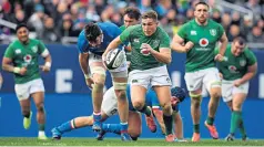  ??  ?? Glory boy: Jordan Larmour sprints ahead of Italy’s defence on the way to his second try