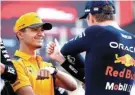  ?? Picture: CLIVE ROSE/GETTY IMAGES ?? SIZING HIM UP: Lando Norris of McLaren talks to Red Bull Racing’s Max Verstappen at the Abu Dhabi Grand Prix in November