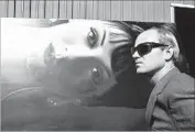  ??  ?? POP ARTIST James Rosenquist posed in 1964. Hopper’s photograph­s are on view at the Kohn Gallery.