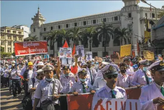  ?? New York Times ?? Myanmar railway workers — who continue to strike — protested last week in Yangon. Threequart­ers of the nation’s civil servants are on strike and all private banks are closed.