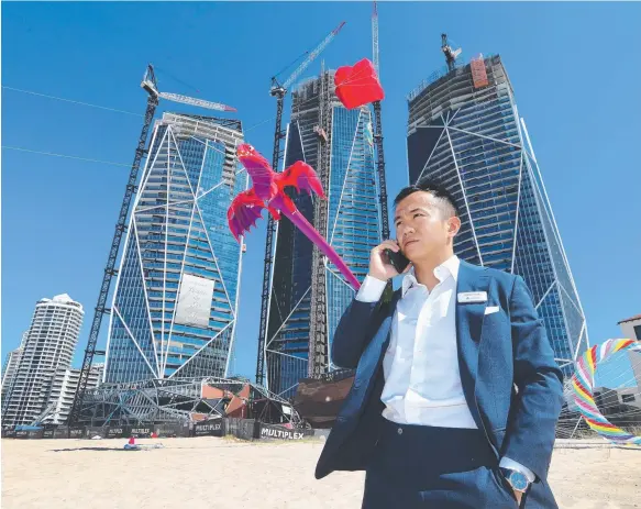  ?? Picture: GLENN HAMPSON ?? Jimmy Huang of Yuhu Group earlier this year on site. A source involved with the company’s Jewel developmen­t says “money is no object”.