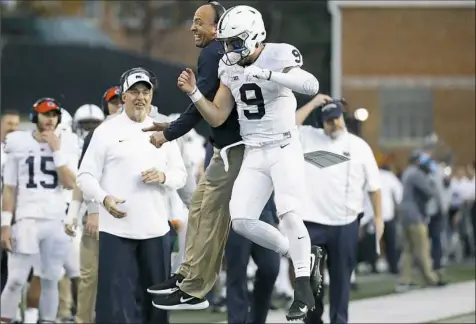  ??  ?? Coach James Franklin, center left, and quarterbac­k Trace McSorley will have to figure out a Washington defense that has limited the kind of big plays the Nittany Lions repeatedly have pulled off this season.