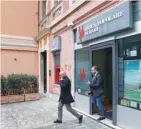  ?? — Reuters ?? People exit the Banca Popolare di Bari bank, in Rome, Italy.