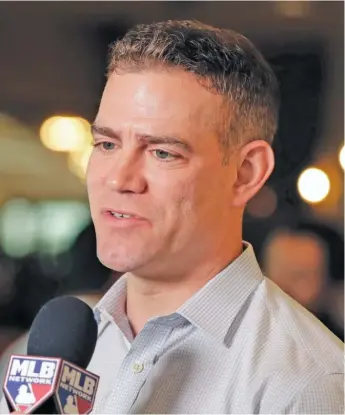  ?? AP ?? Commission­er Rob Manfred (left) says MLB is in a dire place, with teams approximat­ely $8.3 billion in debt. Cubs president Theo Epstein and the front office is in a tough spot assembling a teamwith an unknown financial landscape.