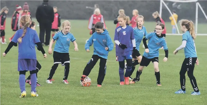  ??  ?? Russell Foster Football League action at East Durham College, Peterlee with St Cuthberts Amazons Bombers (blue) and Boldon CA Girls (purple)