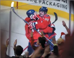  ?? AP PHOTO/NICK WASS ?? Washington Capitals right wing Justin Williams (14) celebrates his winning goal with center Marcus Johansson (90) in the overtime period of Game 5 in an NHL Stanley Cup hockey first-round playoff series against the Toronto Maple Leafs, Friday in...