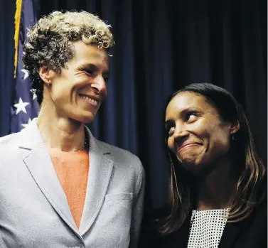  ?? MATT SLOCUM / THE ASSOCIATED PRESS ?? Andrea Constand, left, the Canadian woman who was one of Bill Cosby’s key accusers, shares a smile with prosecutor Kristen Feden Tuesday after the comedian was sentenced to three to 10 years in state prison for sexual assault.