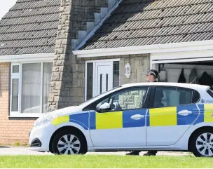  ??  ?? Police at Back Lane, Aughton, after the armed robbery