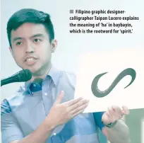  ??  ?? Filipino graphic designerca­lligrapher Taipan Lucero explains the meaning of ‘ ha’ in baybayin, which is the rootword for ‘spirit.’