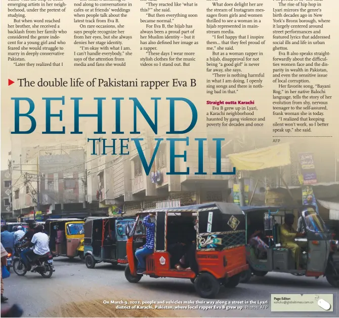  ?? ?? On March 9, 2022, people and vehicles make their way along a street in the Lyari district of Karachi, Pakistan, where local rapper Eva B grew up. Photos: AFP