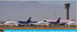  ??  ?? SANTIAGO: In this file photo, aircraft of Latam airline sit on the tarmac at Santiago Internatio­nal Airport, in Santiago, during the new coronaviru­s, COVID-19, pandemic. Latin America’s biggest airline, the Brazilian-Chilean group LATAM, filed for bankruptcy in the US.—AFP