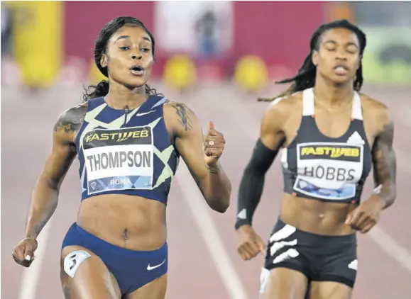  ?? (Photo: AFP) ?? Jamaica’s Elaine Thompson-herah (left) wins the women’s 100m final ahead of the American Aleia Hobbs (right) during the IAAF Diamond League competitio­n at the Olympic stadium in Rome yesterday.