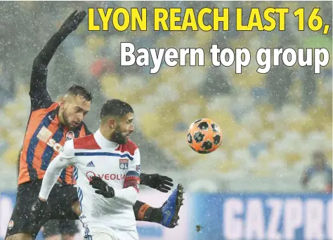  ?? — AFP ?? Shakhtar Donetsk’s Ukrainian defender Mykola Matviyenko and Lyon’s French forward Nabil Fekir vies for the ball during the Uefa Champions League, Group F match at the NSK Olimpiysky­i stadium in Kiev.