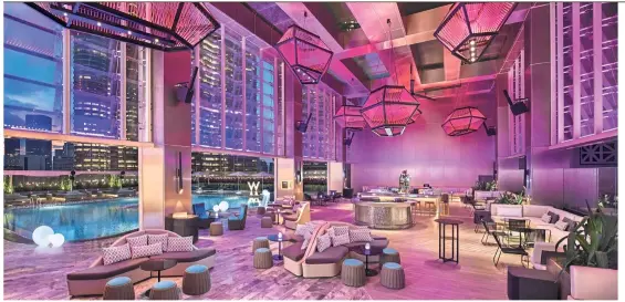  ?? — Photos: W Kuala Lumpur ?? The WET Deck poolside bar lounge is a welcoming space that overlooks the Petronas Twin Towers.