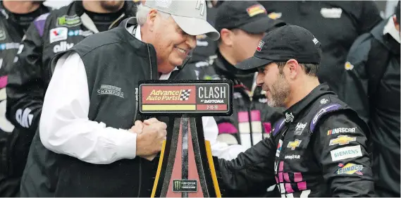  ?? JOHN RAOUX/THE ASSOCIATED PRESS ?? Car owner Rick Hendrick congratula­tes driver Jimmie Johnson after he won the NASCAR Clash auto race at Daytona Internatio­nal Speedway on Sunday.