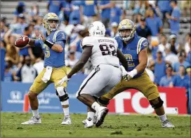  ?? DANNY MOLOSHOK / ASSOCIATED PRESS ?? UCLA quarterbac­k Josh Rosen passed for 292 yards and four touchdowns in the fourth quarter alone. The Bruins trailed 44-10 late in the third.