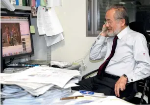  ??  ?? Ohsumi answers a phone call following the news that he won this year’s Nobel Prize in medicine at his office in the Tokyo Institute of Technology campus in Yokohama, south of Tokyo, on Monday.