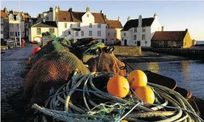  ??  ?? HAPPIEST: A fishing harbour on the east coast of Fife, which has topped an index rating happiness