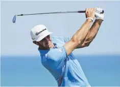  ?? AP PhOTO ?? EYES ON THE PRIZE: Dustin Johnson watches his shot on the third hole during yesterday’s practice round for the PGA Championsh­ip at Whistling Straits in Sheboygan, Wis.