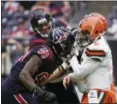  ?? ERIC CHRISTIAN SMITH — ASSOCIATED PRESS ?? The Texans’ J.J. Watt (99) and Jadeveon Clowney (90) pressure Baker Mayfield on Dec. 2 in Houston.