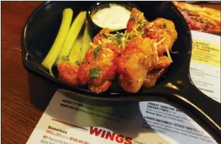  ?? MATT ROURKE — THE ASSOCIATED PRESS ?? With the Super Bowl at hand, behold the cheerful untruth that has been perpetrate­d upon (and generally with the blessing of) the chicken-consuming citizens of the United States on menus across the land: a “boneless wing” that isn’t a wing at all.