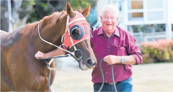  ??  ?? Hastings trainer Lee Somervell looks happy with himself as he leads Thousandki­ssesdeep away following the filly’s dominant maiden win at Tauherenik­au last Sunday.