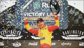  ?? James Gilbert / Getty Images ?? Joey Logano celebrates after winning the NASCAR Cup Series Goodyear 400 on Sunday at Darlington Raceway in Darlington, S.C.