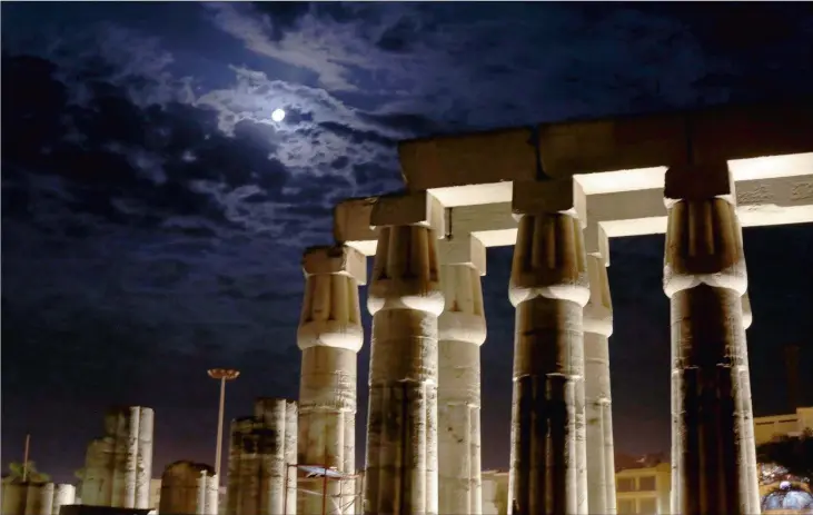  ?? Pictures: AP ?? ANCIENT MARVELS: A full moon looms over the ruins of Luxor Temple in Luxor, Egypt. Luxor Temple sits on the east bank of the Nile River. On the west is the Valley of the Kings and the Valley of the Queens.