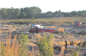  ??  ?? Sand poaching is now a menace in areas around Harare. This picture collage shows trucks being loaded with sand for sale to people building homes, and man-made gullies left by sand poachers in Eyecourt, Harare. — Pictures: Innocent Makawa