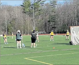 ?? NICK MALLARD / SENTINEL & ENTERPRISE ?? The Fitchburg State women’s lacrosse team lines up for a shooting drill during Thursday’s practice.