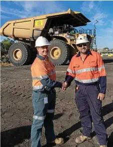  ?? Photo:Contribute­d ?? JOB DONE: Hastings Deering Service Manager Justin Butcher (left) hands over the last of the trucks to Rob Trapp, Maintenanc­e Supervisor at New Acland Mine.