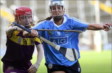  ??  ?? Wexford’s Amy Cardiff challenges Eimear McCarthy of Dublin.