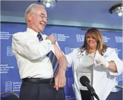  ?? PABLO MARTINEZ MONSIVAIS/AP ?? Health and Human Services Secretary Tom Price is given a bandage Thursday after a flu shot from Sharon Walsh-Bonadies in Washington. At a news conference, federal health officials promoted flu shots, saying the season could be rough.