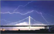 ?? PHOTOS BY NOAH BERGER — THE ASSOCIATED PRESS FILE ?? On Aug. 16, lightning forks over the San Francisco-Oakland Bay Bridge as a storm passes over Oakland. Numerous lightning strikes sparked brush fires throughout the region.