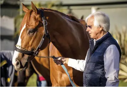  ?? Picture: Eclipse Sportswire ?? WINNING COMBINATIO­N. Trainer Bob Baffert with Justify who will be aiming to win the Triple Crwn when he lines up in Saturday’s Belmont Stakes over 2400m.