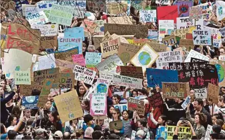  ?? AFP PIC ?? Students taking part in a protest against climate change in Hong Kong yesterday.