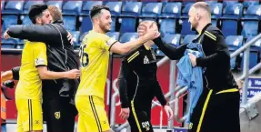  ??  ?? Job done The Livi camp celebrate at Falkirk after the final whistle