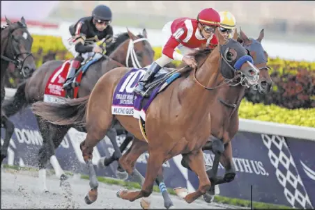  ?? Lynne Sladky The Associated Press ?? Jockey Irad Ortiz Jr. rides Mucho Gusto (10) to victory in the $3 million Pegasus World Cup Invitation­al on Saturday at Gulfstream Park in Hallandale, Fla. The two morning-line favorites, Omaha Beach and Spun to Run, were scratched Thursday.