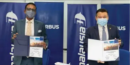 ??  ?? Airbus SE Asia-Pacific president Anand Stanley (left) and Malaysia Airlines group chief operations officer Ahmad Luqman Mohd Azmi at the Flight Hour Services Components agreement signing ceremony yesterday.