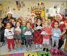  ??  ?? Children at Hobe Sound Early Learning Center during the Toys for Tots drive.