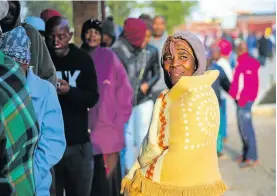  ?? Picture: Alaister Russell ?? Residents brave the cold in Chiawelo, Soweto, to vote in the sixth general election since the dawn of democracy in 1994.