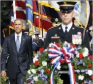  ?? THE ASSOCIATED PRESS ?? President Barack Obama arrives to lay the wreath at the Tomb of the Unknowns, on Friday at Arlington National Cemetery in Arlington, Va.