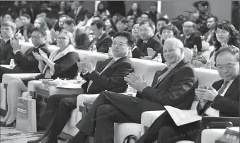  ?? -AFP ?? Yang Xiaowei (center), deputy head of the Cyberspace Administra­tion of China, is seen at the opening ceremony of the ChinaRussi­a Internet Media Forum.