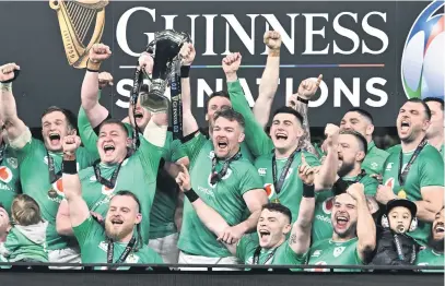  ?? Picture: Getty Images ?? GREEN MACHINE. Irish captain Peter O’Mahony lifts the Six Nations trophy after securing the title when they beat Scotland in Dublin on Saturday.