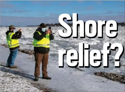  ?? U.S. ARMY PHOTO BY WILLIAM DOWELL ?? U.S. Army Corps of Engineers, Detroit District, field team Senior Hydraulic Engineer Matt McClerren, left, and Hydraulic Technician Jon DePhillips document St. Clair River ice jams on the St. Clair River at Algonac State Park February 3, 2021.