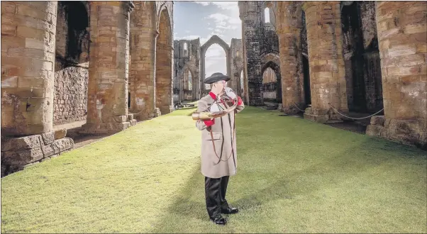  ?? PICTURE: CHARLOTTE GRAHAM ?? A CHANGE OF SCENERY: Ripon hornblower Wayne Cobbett practises for Yorkshire Day at National Trust site Fountains Abbey and Studley Royal, ahead of Yorkshire Day celebratio­ns.