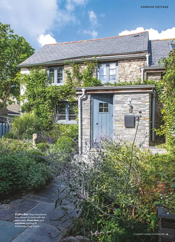  ??  ?? Exterior Grey woodwork was chosen to tone with the slate walls. Front door and windows painted in Anthracite Grey, Dulux cornish cottage