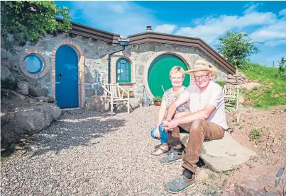  ??  ?? Ian Keir and his wife Heather outside one of the hobbit houses. Below: an interior shot.