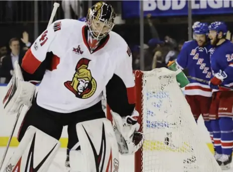  ?? FRANK FRANKLIN II/THE ASSOCIATED PRESS ?? Sens goalie Craig Anderson got the hook after allowing three goals — two by Oscar Lindberg, right — on 20 shots against the Rangers on Thursday night.
