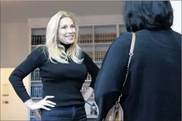  ?? Photograph­s by Lawrence K. Ho
Los Angeles Times ?? HOSTESS CHERYL SHUMAN, a cancer survivor who uses pot regularly and who calls herself “the Martha Stewart of marijuana,” greets guests at a recent “cannabis networking event” in West Hollywood.